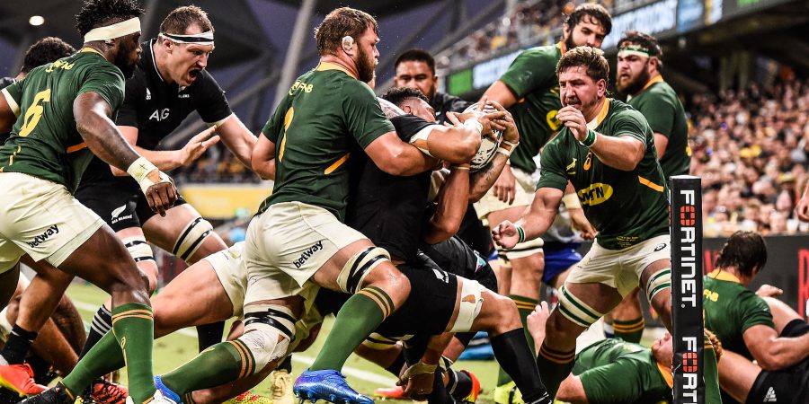 TOWNSVILLE, AUSTRALIA - SEPTEMBER 25: Luke Jacobson of the All Blacks is tackled during the Rugby Championship match between the New Zealand All Blacks and the South African Springboks at QCB Stadium on September 25, 2021 in Townsville, Australia. (Photo by Matt Roberts/Getty Images)