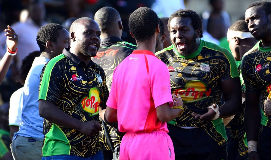 Nakuru RFC's Oscar Ouma consults referee in apast clash. Photo Courtesy/ Denis Acre-half