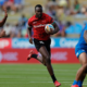 Kenya's Edmund Anya attacks against the Samoa defense on day one of the HSBC Hamilton Sevens at FMG Stadium Waikato on January 21, 2023. Photo credit: Mike Lee - KLC fotos for World Rugby