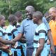 Koyonzo players interact with KRU Directors Ochieng Ahaya and Moses Mukabane. PHOTO/Kakamega County