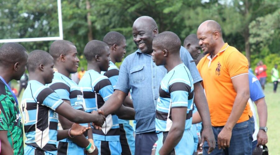 Koyonzo players interact with KRU Directors Ochieng Ahaya and Moses Mukabane. PHOTO/Kakamega County