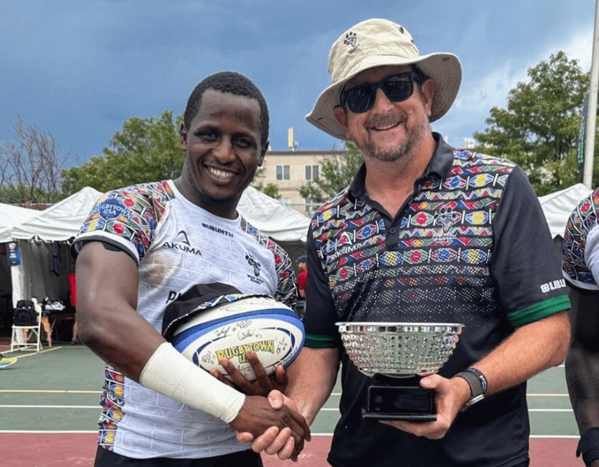 Timothy Mmasi with Wilddogs representative. Photo/Wilddogs.