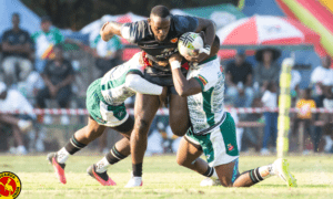 Uganda 7S player tackled by Zimbabwe Cheetahs duo. PHOTO/Uganda rugby Union