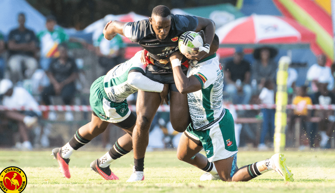 Uganda 7S player tackled by Zambian duo. Photo/Uganda rugby Union