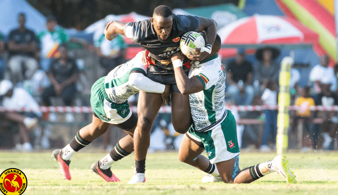 Uganda 7S player tackled by Zimbabwe Cheetahs duo. PHOTO/Uganda rugby Union