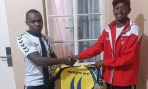 Makueni's Physio Felix Kioko hands over jersey. Photo/Makueni.