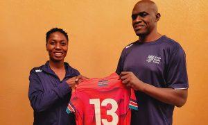 Moreen Muruti receives a jersey from Kenya Lionesses coach Dennis Mwanja. PHOTO/Moreen Muruti.