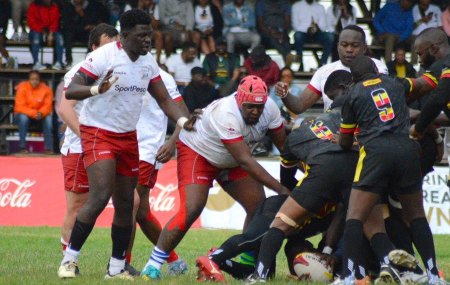 Eddie Omondi and Curtis Lilako defend for Kenya Legends against Uganda in Legends Cup final. PHOTO/Mahlon Lichuma