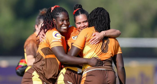 Christabel Lindo celebrates with Serengeti Elephants. squad. PHOTO/R10C