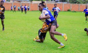 Kisii RFC Victory Gichana dodges tackle against Kisii Polytechnic/ photo: Zapper Images