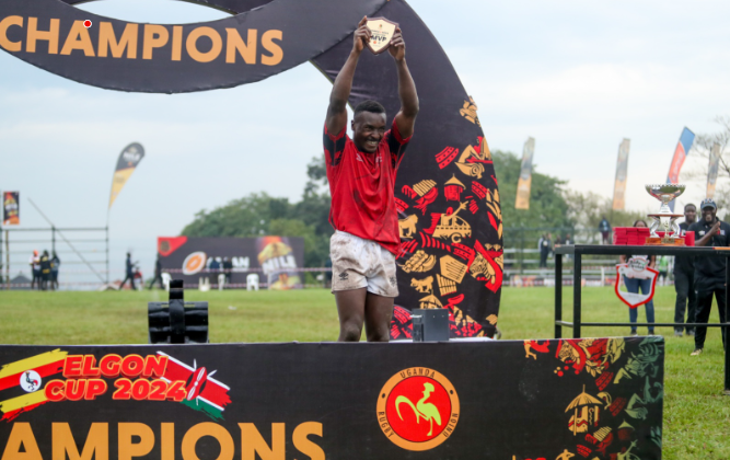 Kenya Simbas winger Griffin Chao hoists MVP trophy. PHOTO/Uganda Rugby Union