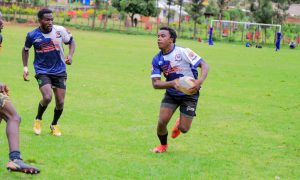 Kisii RFC Frank Mulesi with ball supported by Clifford Nyabwari against Kisii Polytechnic: Photo by Zapper Images