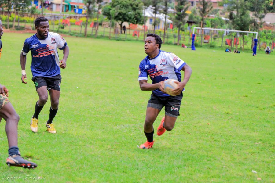 Kisii RFC Frank Mulesi with ball supported by Clifford Nyabwari against Kisii Polytechnic: Photo by Zapper Images