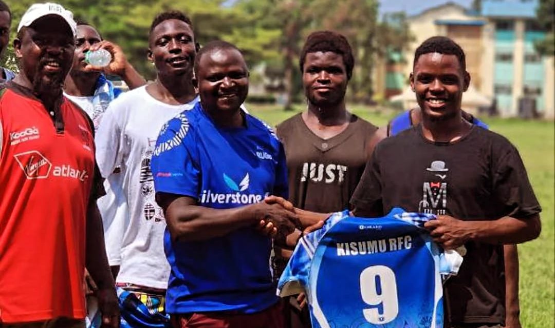 Warren Kamadi receiving Kisumu RFC kit. PHOTO/Kisumu RFC