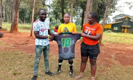 Maryline Amita receives number 10 jersey donated by Charlotte Caslick. PHOTO/Kabras