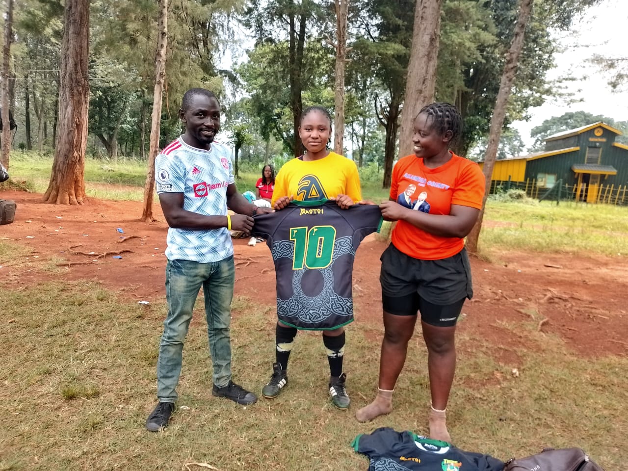 Maryline Amita receives number 10 jersey donated by Charlotte Caslick. PHOTO/Kabras