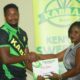 Kabras RFC playmaker Ntabeni Dukisa receives his award as Player of the season. PHOTO/Scrummage Africa