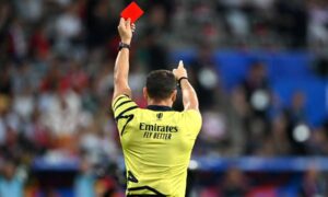 Referee Karl Dickson presents a red card during the Rugby World Cup France 2023. PHOTO/AFP