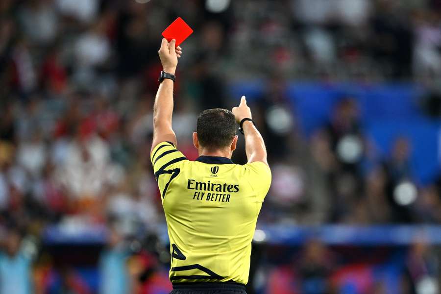 Referee Karl Dickson presents a red card during the Rugby World Cup France 2023. PHOTO/AFP