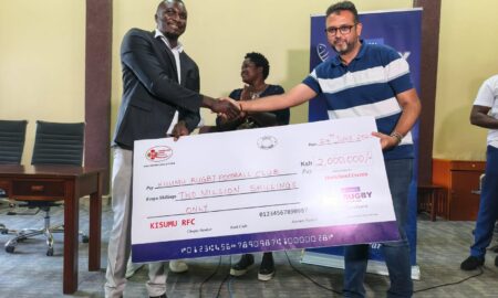 Kisumu RFC chairman Dr Gabriel Ouma receives a dummy cheque from Homeland Itoya events. PHOTO/Brian Mwenje