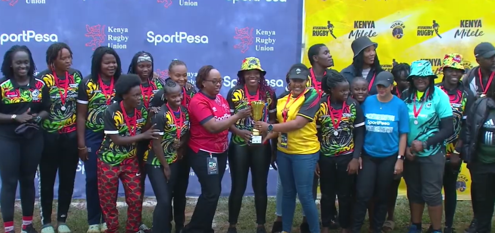 Mwamba RFC ladies receive trophy. PHOTO/KRU
