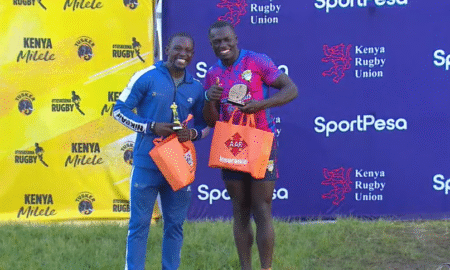 Tyson Juma (MMUST) left Denis Abukuse (Menenegai Oilers) right pose with Dala 7s award. PHOTO/Screengrab
