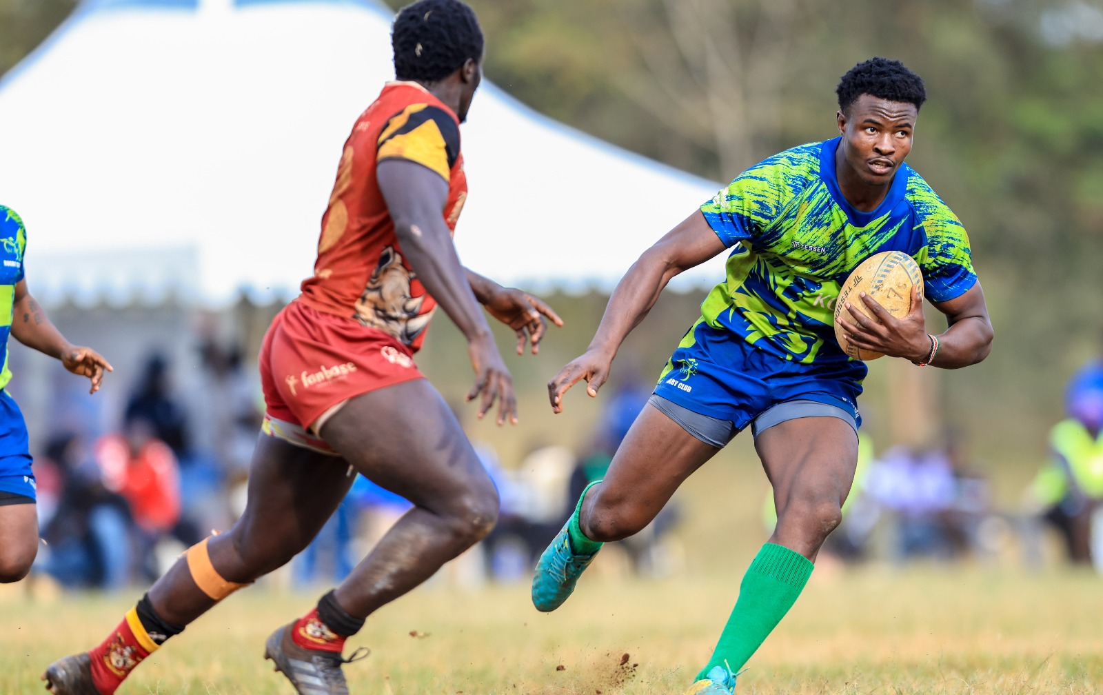 KCB Rugby's Elvis Olukusi charges forward during the Cup final against KU Blak Blad at the Juja 7s tournament held at Jomo Kenyatta University of Agriculture and Technology (JKUAT) on July 12, 2026. PHOTO/KCB Rugby